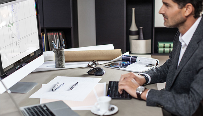 Man working at desk with MX Master