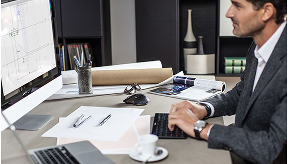 Man working at desk with MX Master