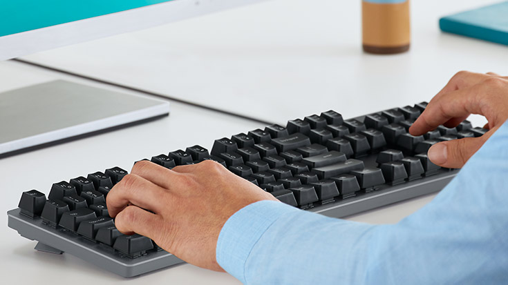 Two hands typing K840 Mechanical Keyboard