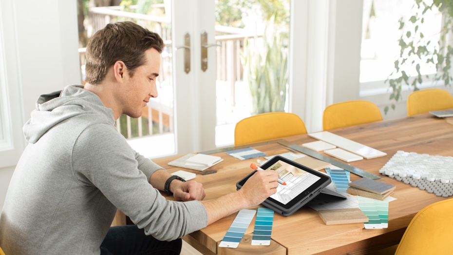 Rugged Folio | a man sketching something on iPad using Logitech Crayon