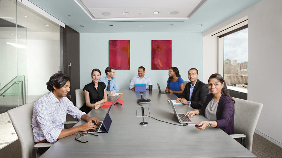 People around video conference table
