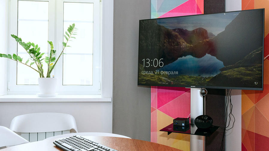 People around video conference table