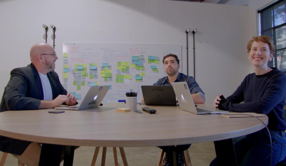 People around video conference table